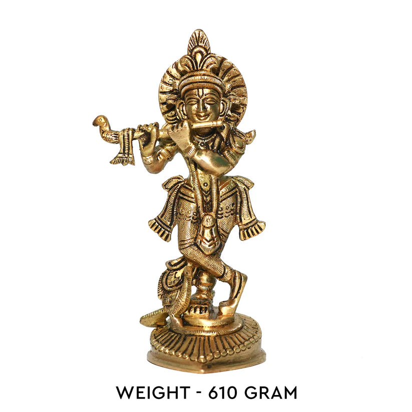 Brass Krishna Ji idol front view with 610 g weight label on white background