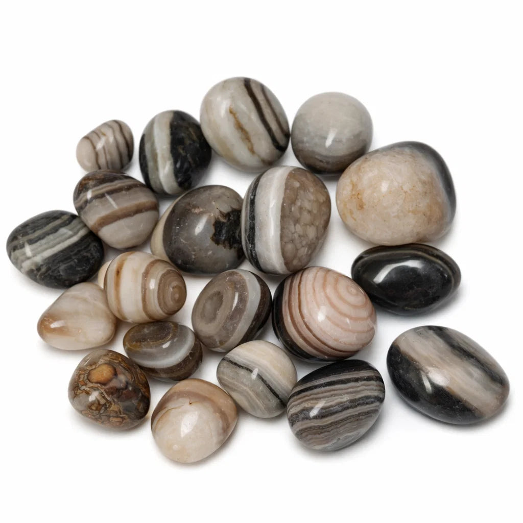 Natural sulemani hakik tumbled stones in a close-up view against a clean white background