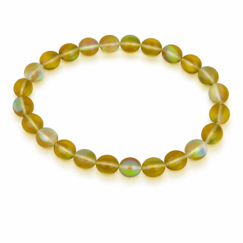 Natural yellow aura quartz crystal bracelet showing the bead colour and surface on white