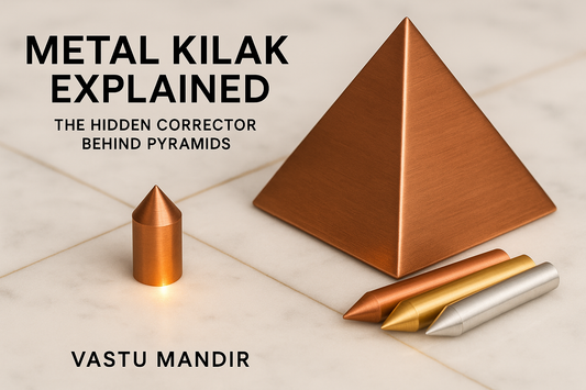 Copper pyramid with Kilak pin beneath on white marble — Vastu Mandir energy anchor for stability.