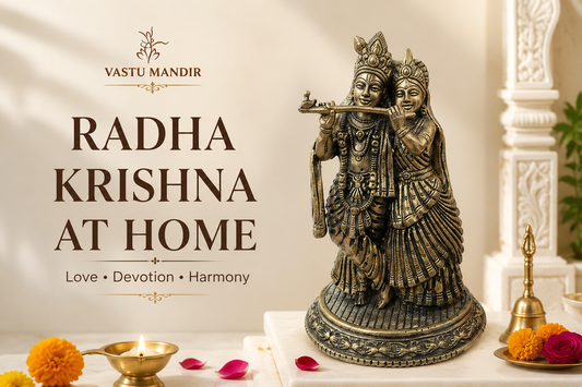 Brass Radha Krishna idol with diya, bell, flowers, peacock feather, and clean sacred tray in a Vastu-aligned Indian home mandir.