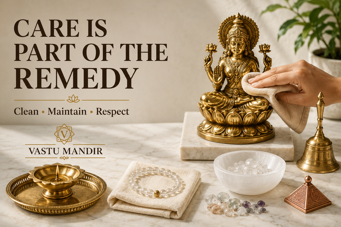 Vastu product care setup with brass idol, bell, diya, crystal bracelet, selenite bowl, copper remedy, and soft cleaning cloth on marble surface.