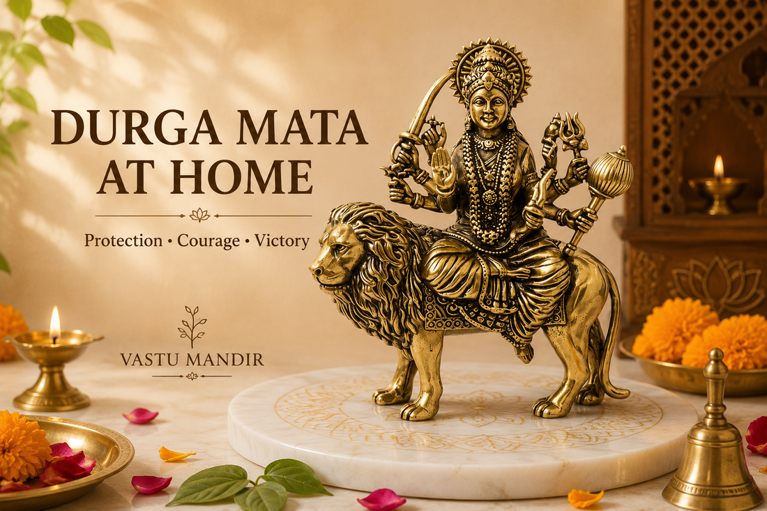 Brass Durga Mata idol with diya, bell, marigold flowers, and clean sacred tray in a Vastu-aligned Indian home mandir.