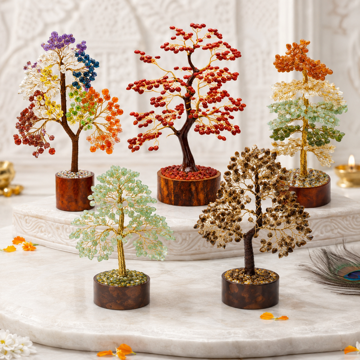  A display of 5 trees, including Citrine, 7 Chakra, Green Aventurine, and two white/pinkish trees - Vastu Mandir
