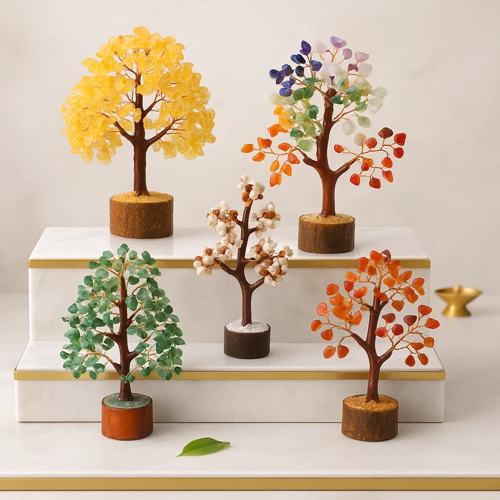  A display of 5 trees, including Citrine, 7 Chakra, Green Aventurine, and two white/pinkish trees - Vastu Mandir