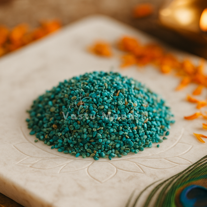 Chrysocolla Crystal Chips on a white plate with orange flowers in the background