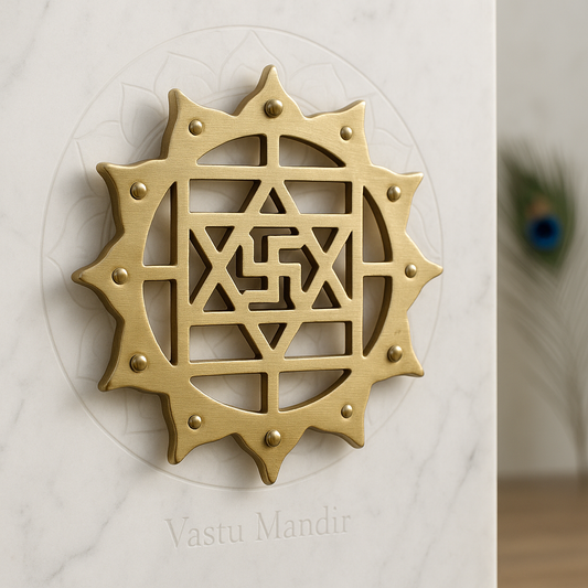 Gold decorative emblem with geometric design on a white background, branded 'Vastu Mandir'.