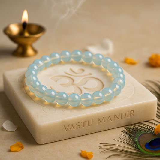 opalite 8mm bead bracelet calming and confidence on a white stone with 'VASTU MANDIR' branding, surrounded by decorative elements.