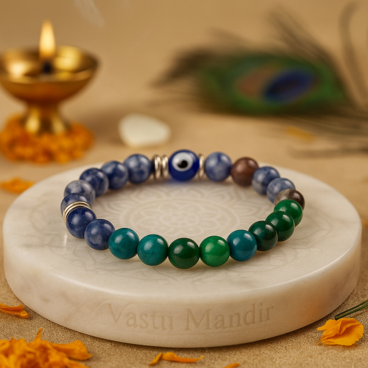pisces zodiac bracelet 8mm with blue, green, and brown beads on a marble coaster with 'Vastu Mandir' branding.