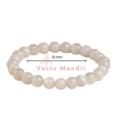 100% Natural Selenite beads with pristine white coloration and luminous transparency with a measurement label and 'Vastu Mandir' branding on a white background