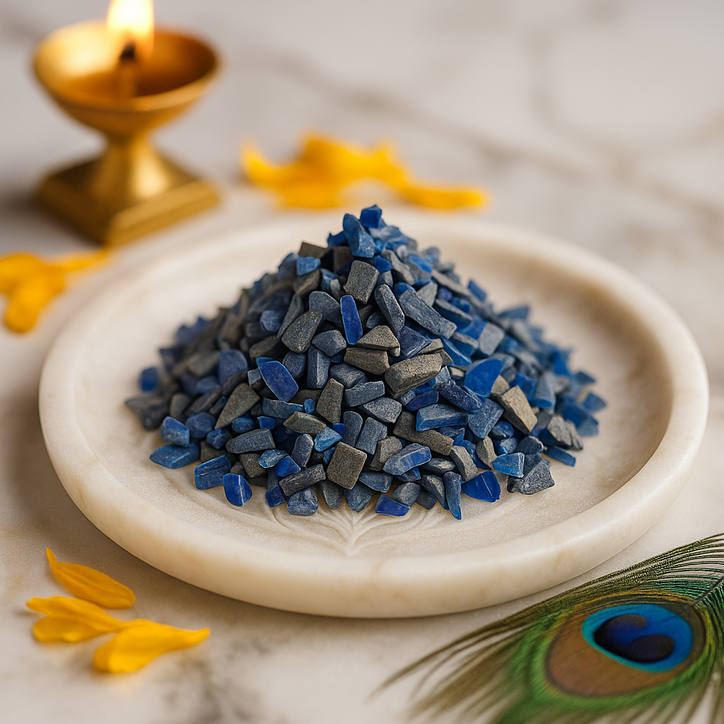 Blue Opal Vastu Dust Remedies on a white plate with a peacock feather and candle in the background