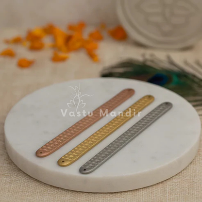 Pyramid Strip 10.5" for Vastu Remedy in Copper, Brass, and Lead on a marble coaster with 'Vastu Mandir' branding.