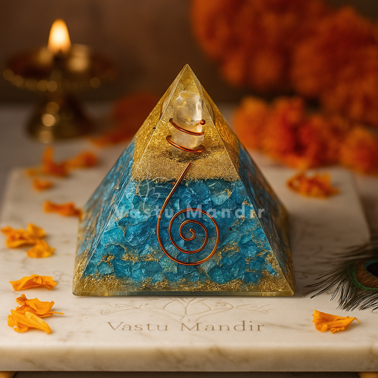 Turquoise Firoza Orgonite Pyramid used as a Vastu remedy to enhance communication and business clarity, on a marble surface, surrounded by flowers and a lit candle.