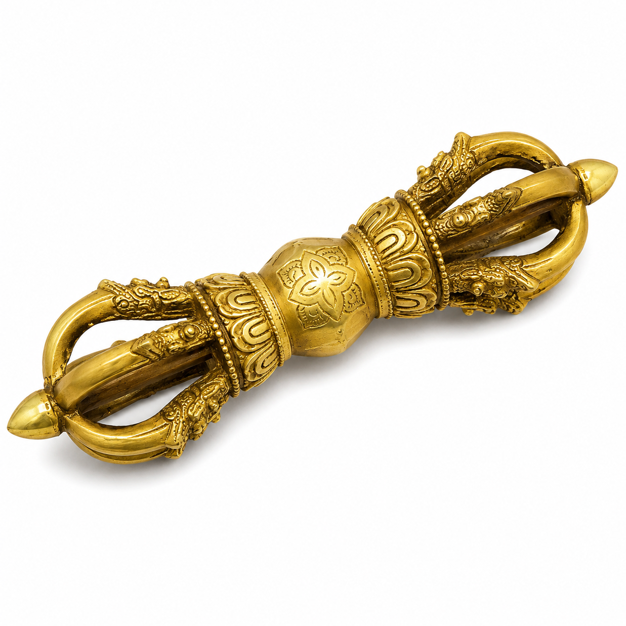 Brass Vajra with intricate designs on a white background