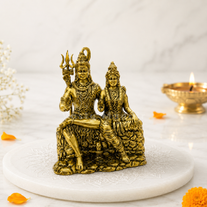 Detailed pure brass Shiva and Parvati statue showing the double Abhaya Mudra blessing