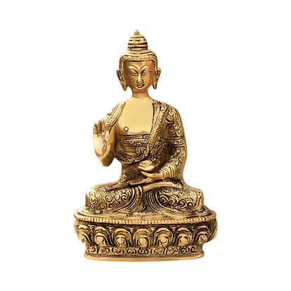 Brass Buddha statue on a white background