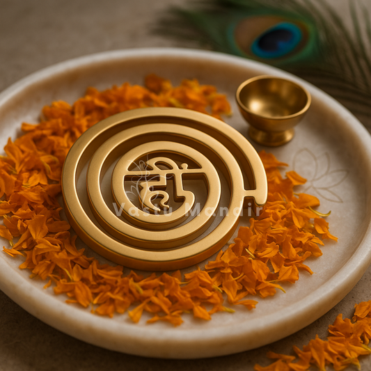 Brass Hii (ही) Spiral Helix on a plate with orange flowers, featuring 'Vedic Mandir' branding.