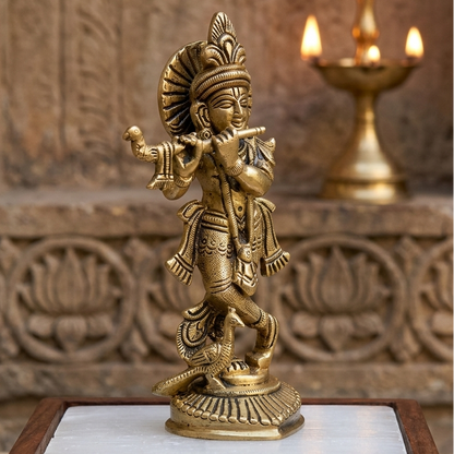 Brass Krishna Ji Idol Vastu Remedy on a wooden base with a decorative background