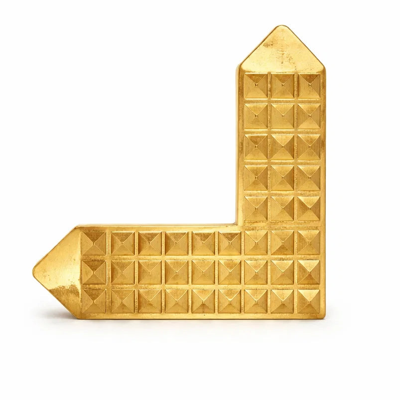 Brass 'L' shaped pyramid angle on a white background
