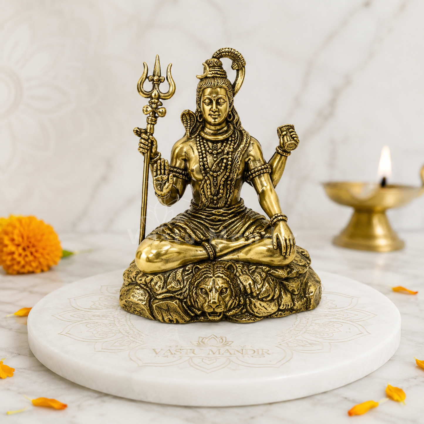 Brass Shiv Ji Blessing Idol on a white platform with a blurred background