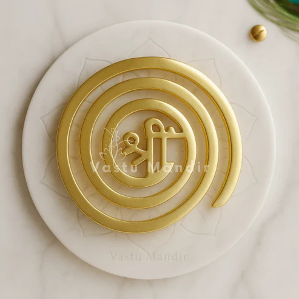 Brass श्री (Shree) Spiral Helix on a white surface with 'Vasu Mandir' branding.