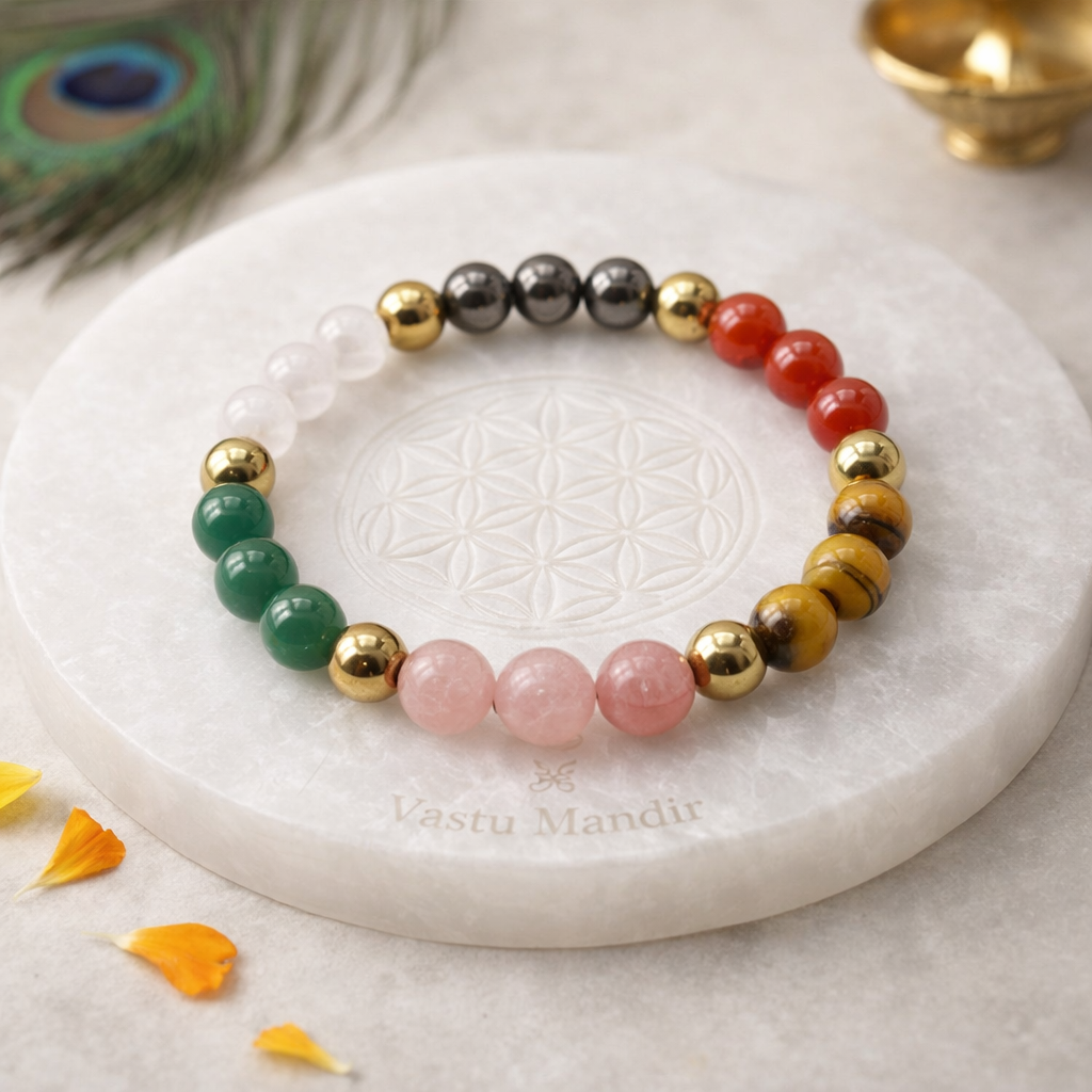 Dhan Vridhi Natural beaded bracelet on a white stone surface with 'Vastu Mandir' branding.