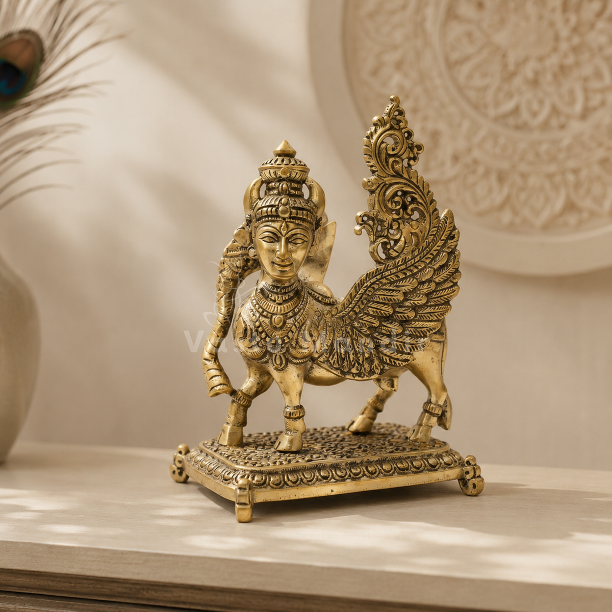 Flying Kamdhenu cow brass idol on a reflective surface with a softly blurred background