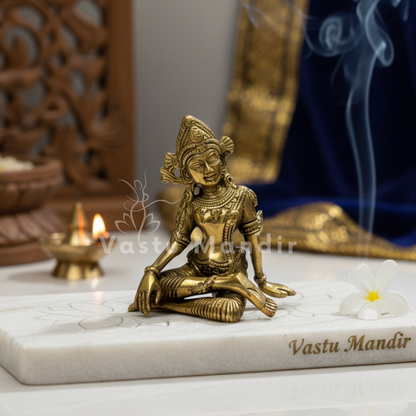 Indra Dev 100% Pure Brass Statue Idol on a marble base with 'Vastu Mandir' branding, surrounded by decorative elements.