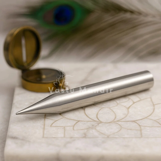 Iron Kilak Rods on a marble surface with a peacock feather in the background