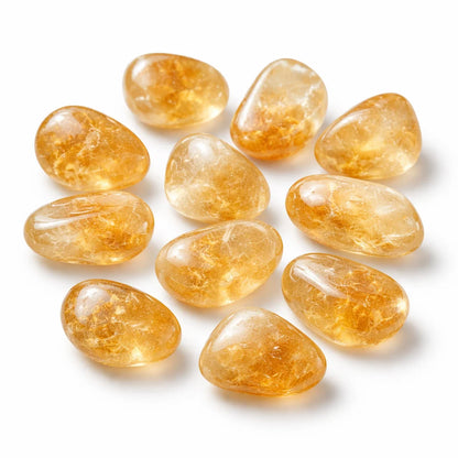 Group of citrine tumbled stones isolated on a clean white background