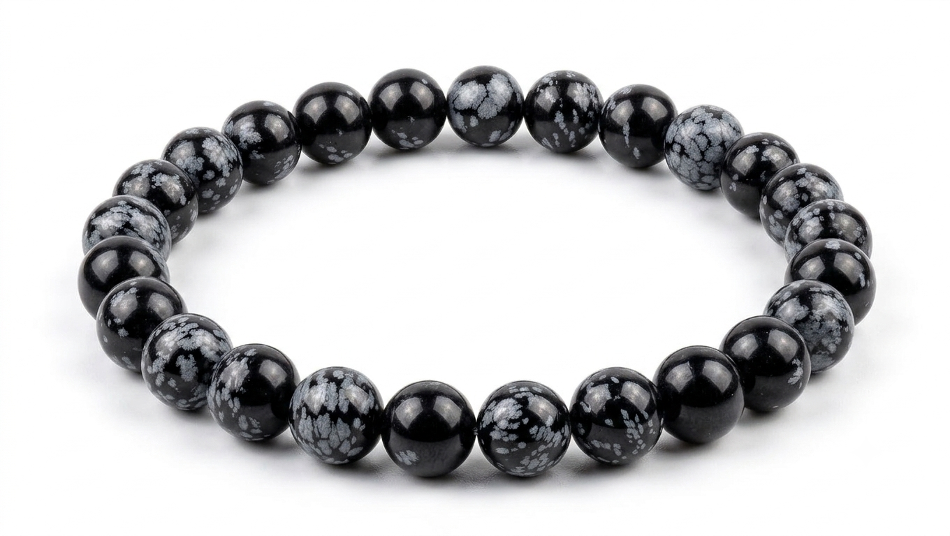 A beaded stretch Natural Snowflake Obsidian Crystal Bracelet featuring white cloudy marbling, presented on a plain white background.