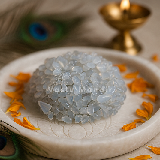 Decorative dish with Opalite Chips and orange petals on a light background