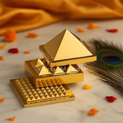 3-Layer Brass Pyramid on a marble surface with decorative elements.