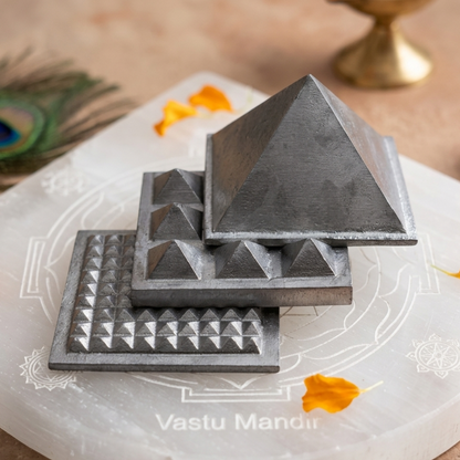 3-Layer Lead Metal Pyramid on a white plate with decorative elements