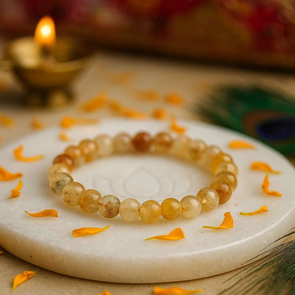 Citrine crystal bracelet on a marble surface with decorative elements
