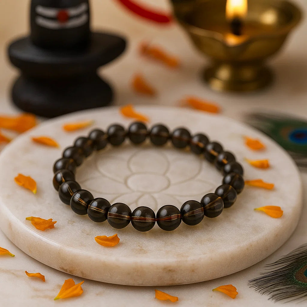 premium smoky brown quartz bracelet on a marble surface with decorative elements