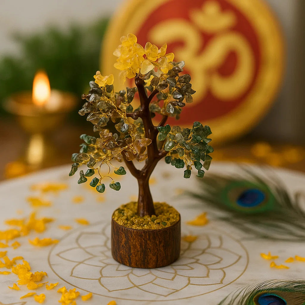 money tree with stones on a wooden base in front of a 'Om' symbol and lit candle.