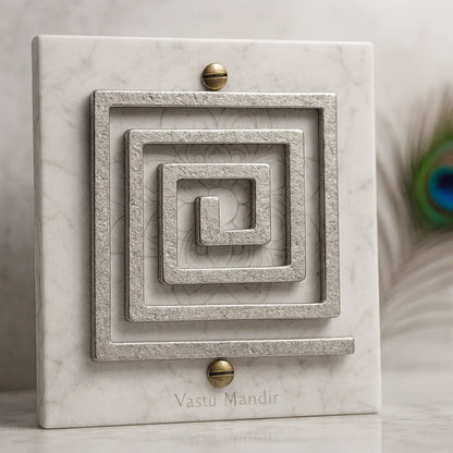 Heavy lead Vastu remedy helix mounted on wall for stability and support


