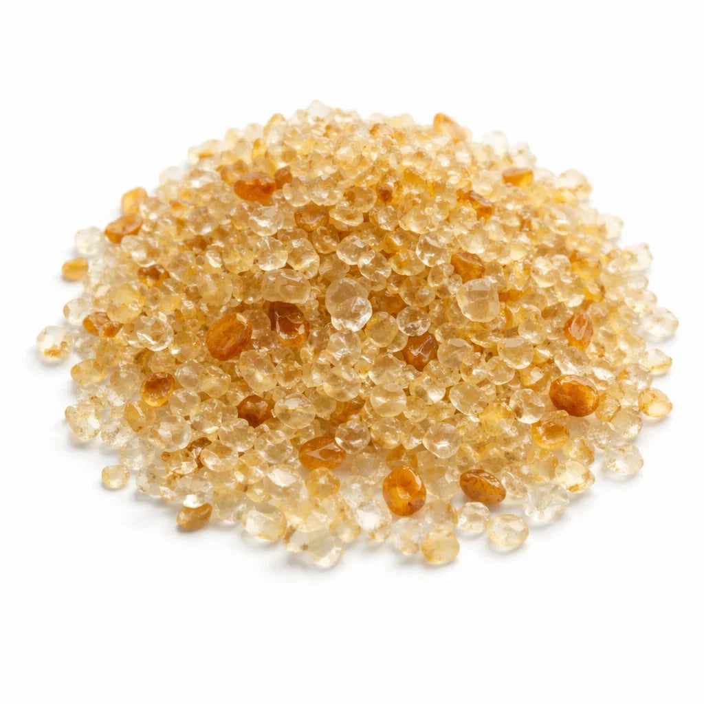 Pile of Citrine Crystal Chips on a white background